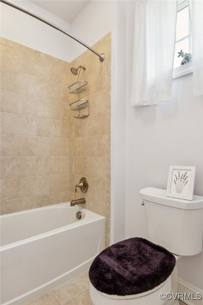 2nd floor full bath with tub/shower combo and tile surround. | Image 41