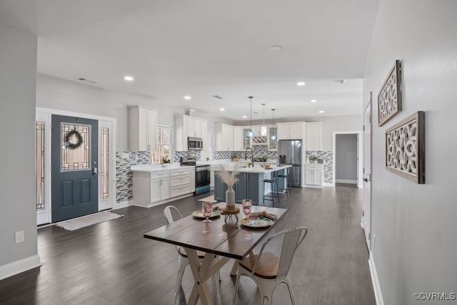 Dining space with LVP flooring and recess lighting | Image 4