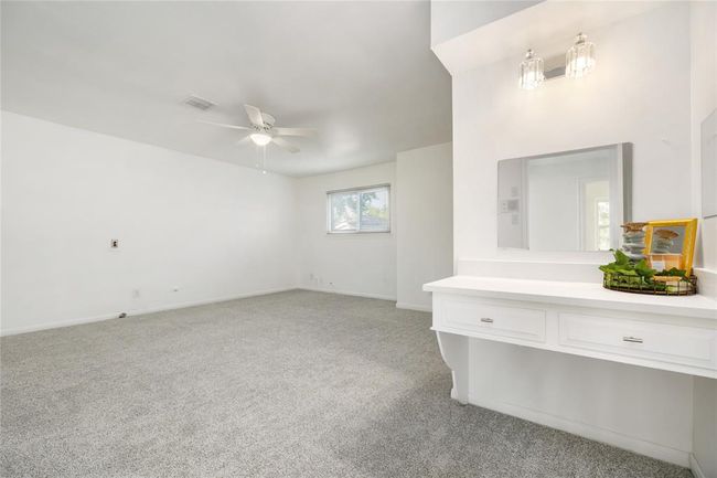 Primary bedroom with vanity and 2 closets, also new fixtures | Image 26
