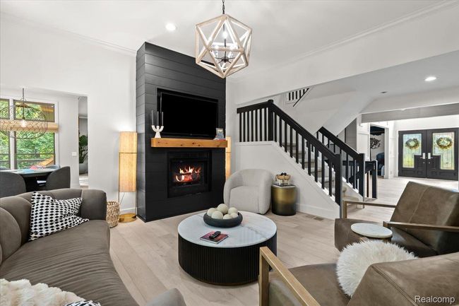 Living room with fireplace. | Image 9