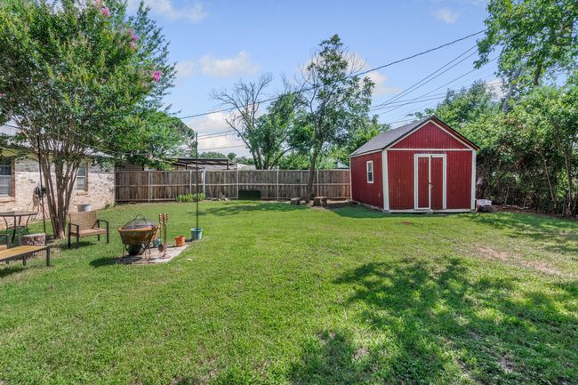 View of yard featuring an outdoor fire pit | Image 21