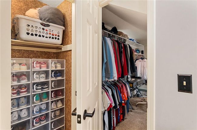 Walk in closet with carpet floors | Image 37