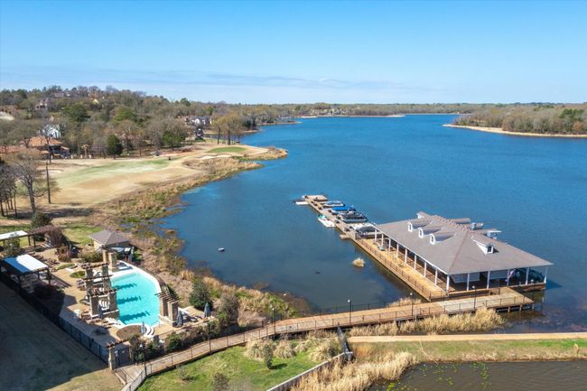 Aerial view of a nearby body of water and a pool area | Image 32