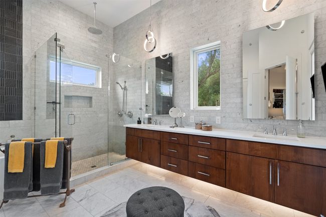 Spa-like finishes elevate this contemporary primary bath retreat. | Image 20