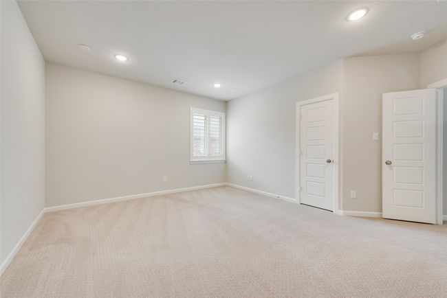 Empty room featuring visible vents, baseboards, recessed lighting, and light carpet | Image 21