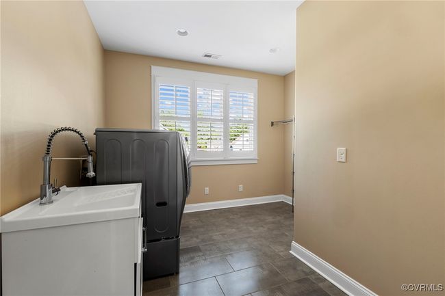 Washroom with washer / clothes dryer and baseboards | Image 23