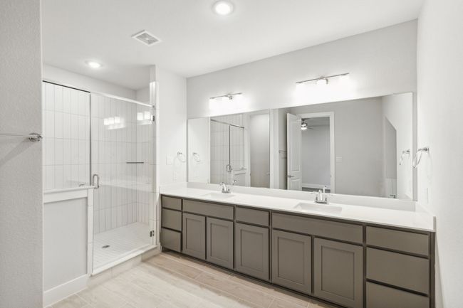 Full bathroom featuring double vanity, a large walk-in shower and recessed lighting | Image 27