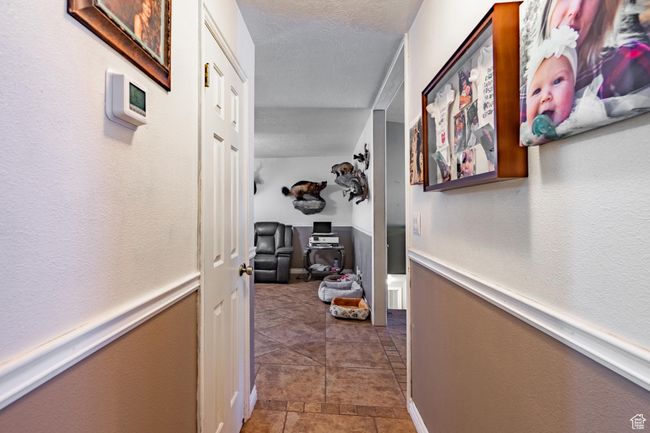 Hallway featuring a textured ceiling | Image 42