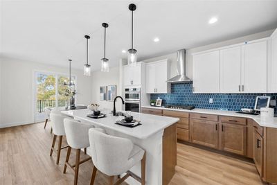 Kitchen with Quartz Countertops and Tile Backsplash | Image 2