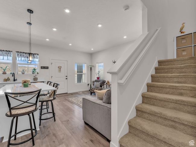 Living area with stairs, recessed lighting, and light wood-type flooring | Image 11