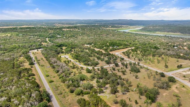 View of property location with a large body of water and a forest | Image 4