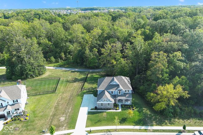 This is the best lot in Hunters Run! It backs up to woods, a walking trail and Thorpe Creek and the large side easement makes it feel even more spacious. Best feature - no neighbors directly behind you! | Image 4