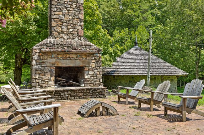 Outdoor fireplace and patio behind the School House | Image 15