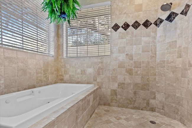 Uniquely designed, the soaking tub is integrated within the shower enclosure. | Image 21