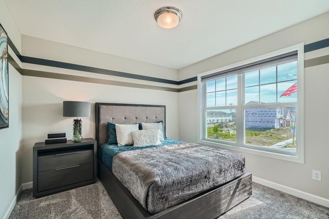 Photo is of the model. Another one of the secondary bedrooms that comes perfectly sized with a spacious closet. | Image 17