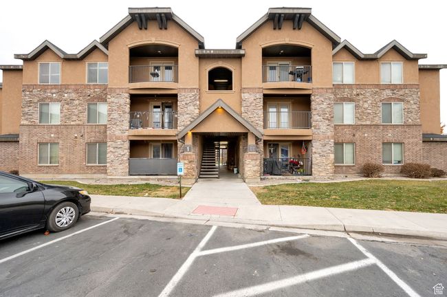 View of property featuring uncovered parking | Image 16