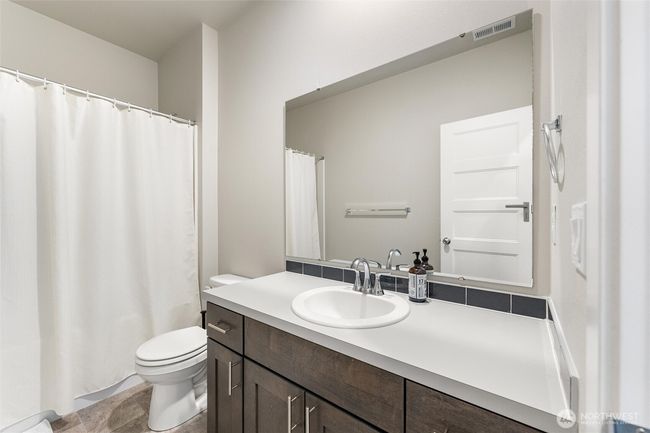 Main floor full bath. | Image 12