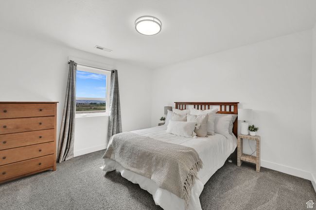 Carpeted bedroom featuring baseboards | Image 37