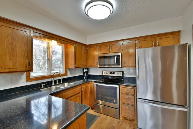 stainless steel appliances window over kitchen sink | Image 28