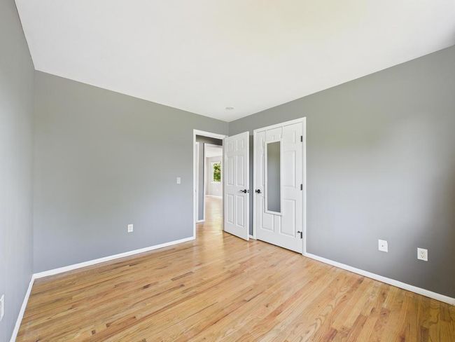 Empty room featuring baseboards and light wood-style floors | Image 23
