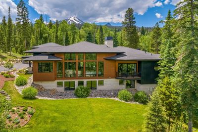 View of front of home with a balcony, a mountain view, and a front lawn | Image 3