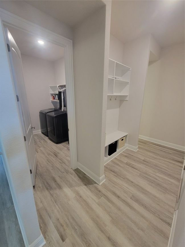 Mudroom featuring light wood-type flooring and baseboards | Image 11