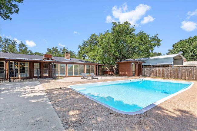 View of pool with a patio and an outbuilding | Image 32