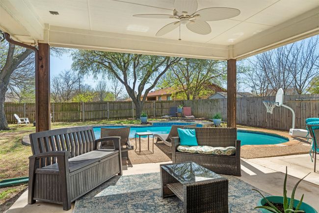 View of patio with a fenced backyard, a fenced in pool, and an outdoor living space | Image 20