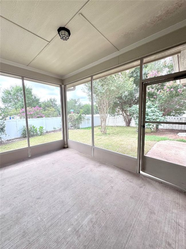 Unfurnished sunroom featuring a water view and healthy amount of natural light | Image 36