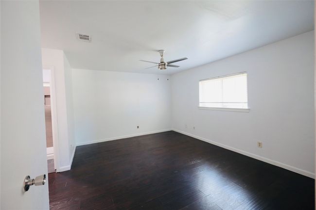 Master Bedroom with wood finished floors and ceiling fan | Image 25