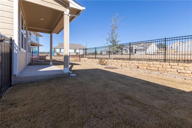 View of fenced backyard | Image 12