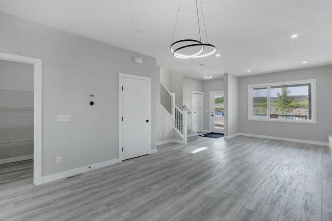 82 Edith Green Nw, Home with 4 bedrooms, 3 bathrooms and 2 parking in Calgary AB | Image 4