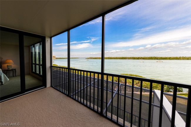 DRAMATIC ESTERO BAY VIEWS FROM NEWLY REFURBISHED LANAI. ENTRANCE TO OWNER'S SUITE SHOWN AT LEFT. | Image 4