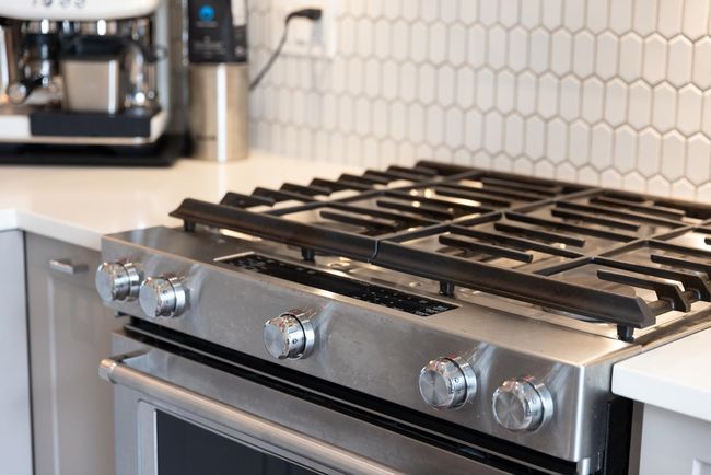 Kitchen view of stainless steel range with gas stovetop and decorative backsplash | Image 33