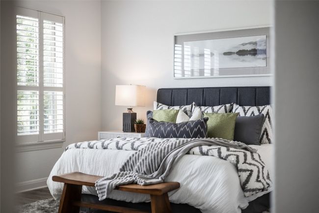 Bedroom with baseboards and wood finished floors | Image 21