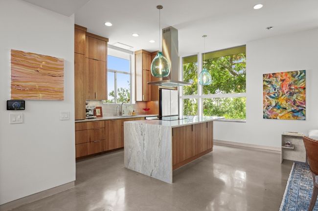Commercial windows and window tint throughout the home with custom smart blinds. | Image 11
