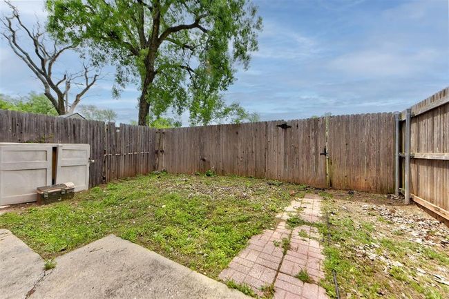 View of yard featuring a fenced backyard | Image 14