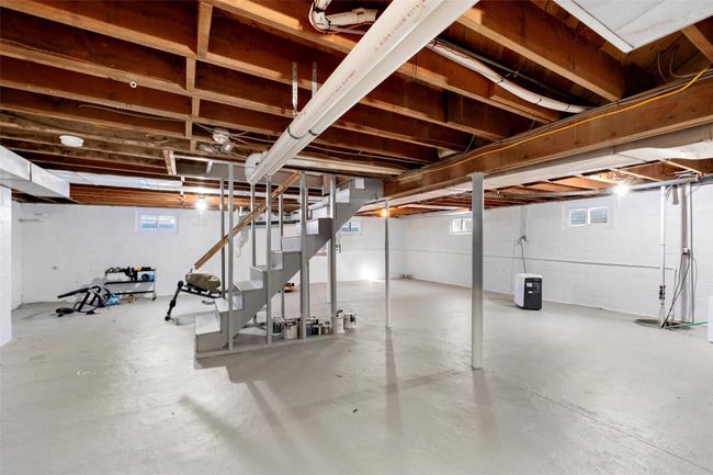 Basement featuring stairs | Image 33