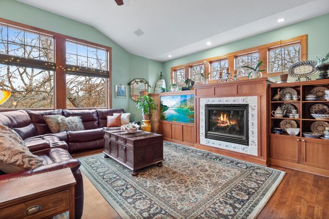 Family room open from kitchen and breakfast area for great entertainment flow. Built-in cherry cabinets with fireplace and media cabinets. Ceiling speakers for connection to media cabinet and whole house audio, wired LAN available | Image 11