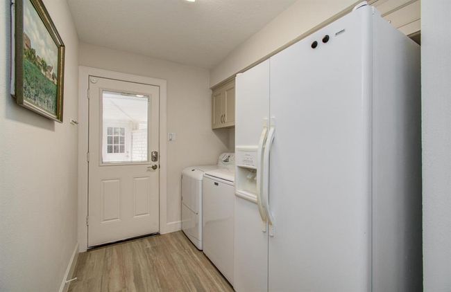 Oversize utility room with built-in cabinets. | Image 35