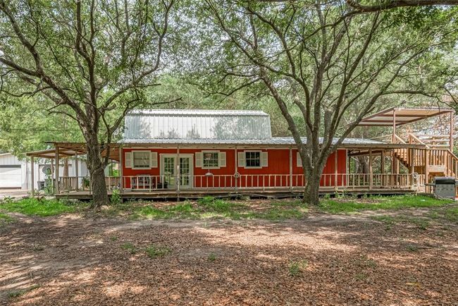 Main house 4 bedrooms 2 bathrooms, metal roof, 2 A/C units, wrap around porch, 2 story outdoor deck | Image 4