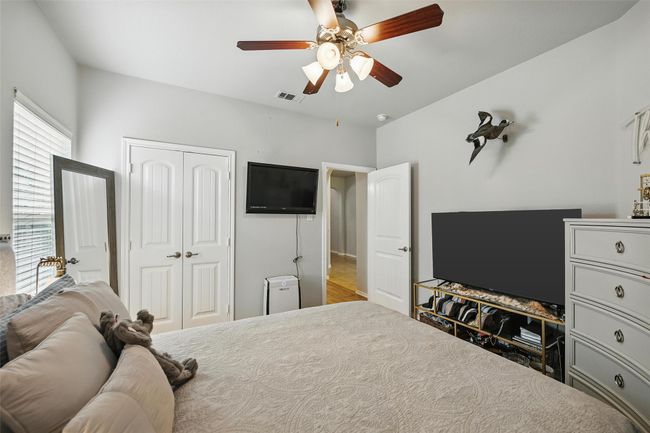 Bedroom featuring a closet and ceiling fan | Image 39