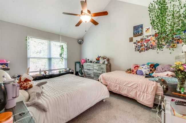 Bedroom with carpet, high vaulted ceiling, and ceiling fan | Image 21