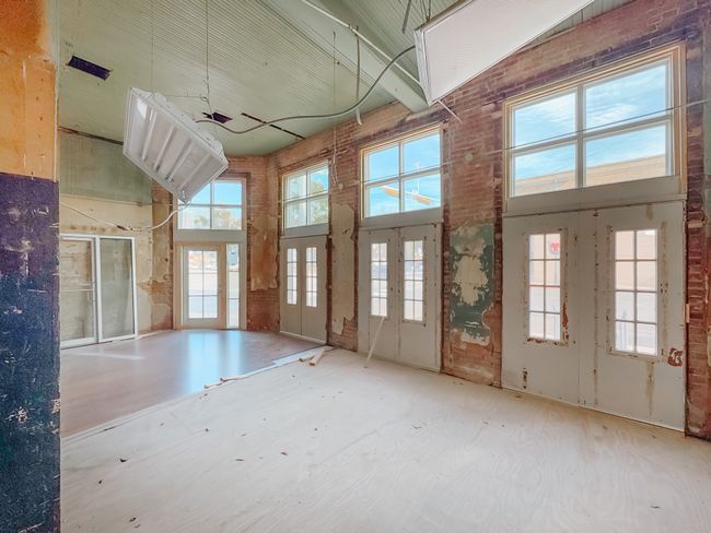 Misc room featuring ceiling fan, high vaulted ceiling, and french doors | Image 7