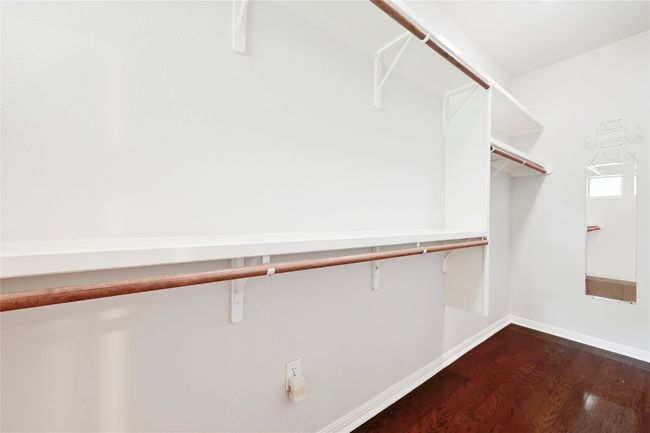 Wall length closet with two double doors for loads of clothes storage. | Image 19