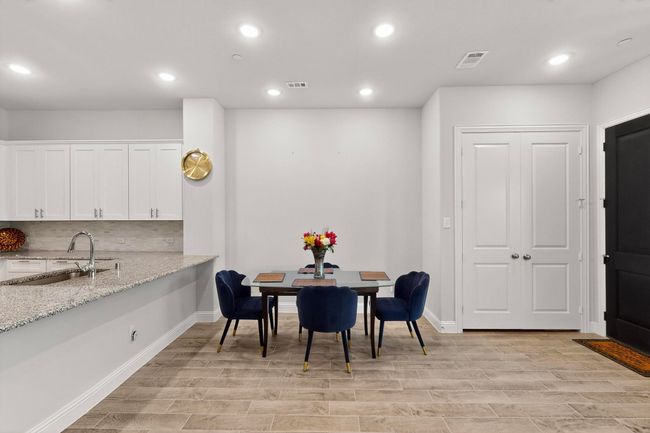 Dining area featuring light wood-style floors and recessed lighting | Image 14