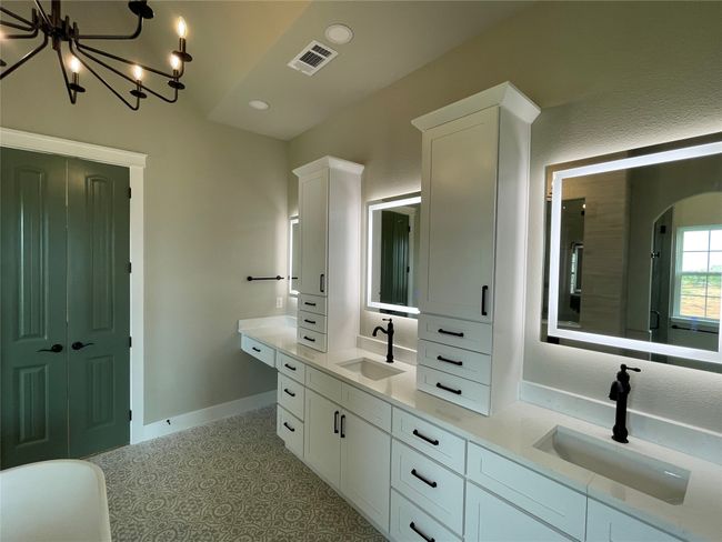 Full bath with double vanity, a chandelier, and recessed lighting | Image 22