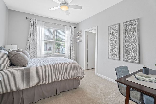 Bedroom featuring carpet floors and ceiling fan | Image 21