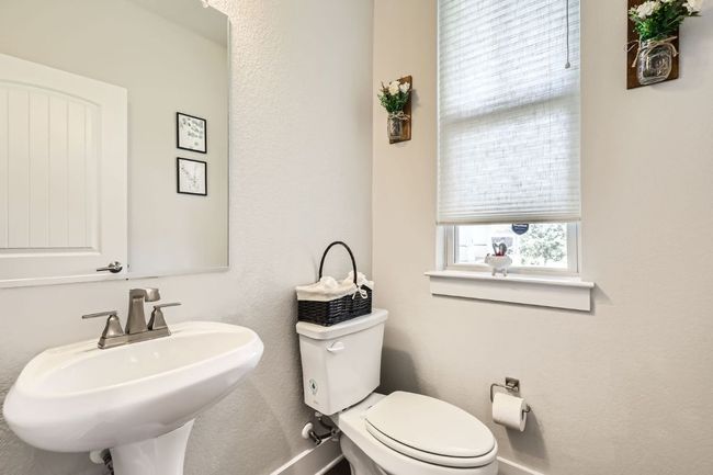 Half bath with a sink and toilet | Image 18