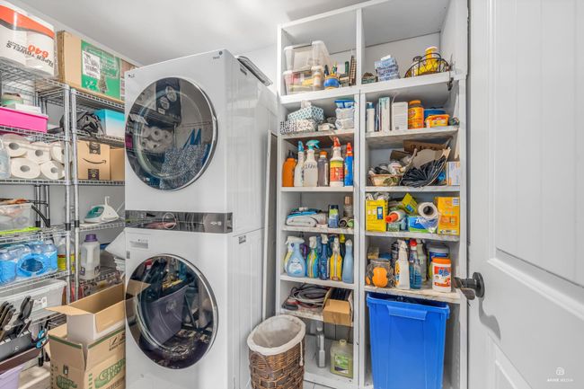 Laundry room featuring estacked washer and dryer | Image 16